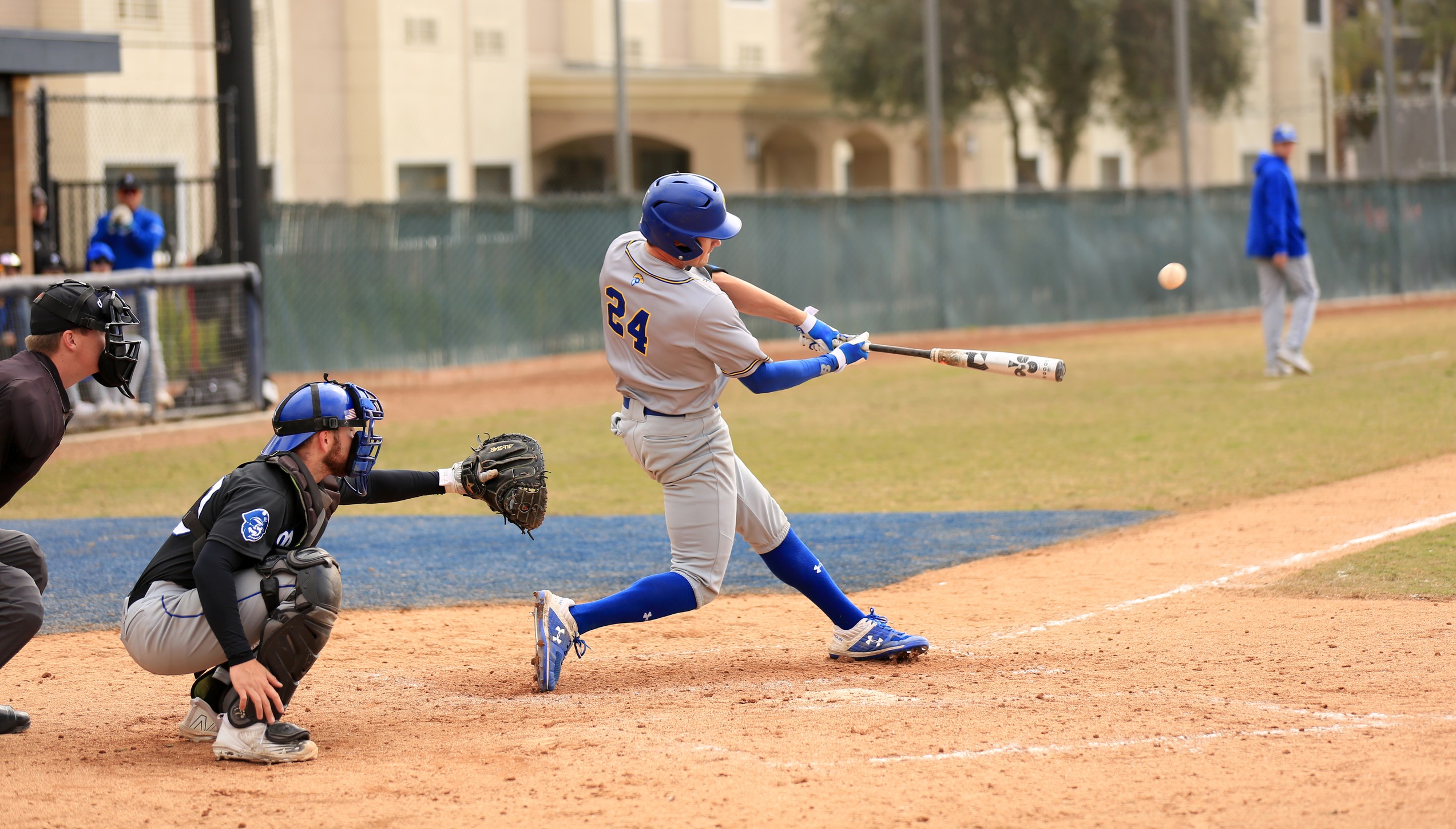 Trey Harmon crushes a three-run double in the top of the sixth inning of Game 1 to open the floodgates. Photo by Brandon Petersen.