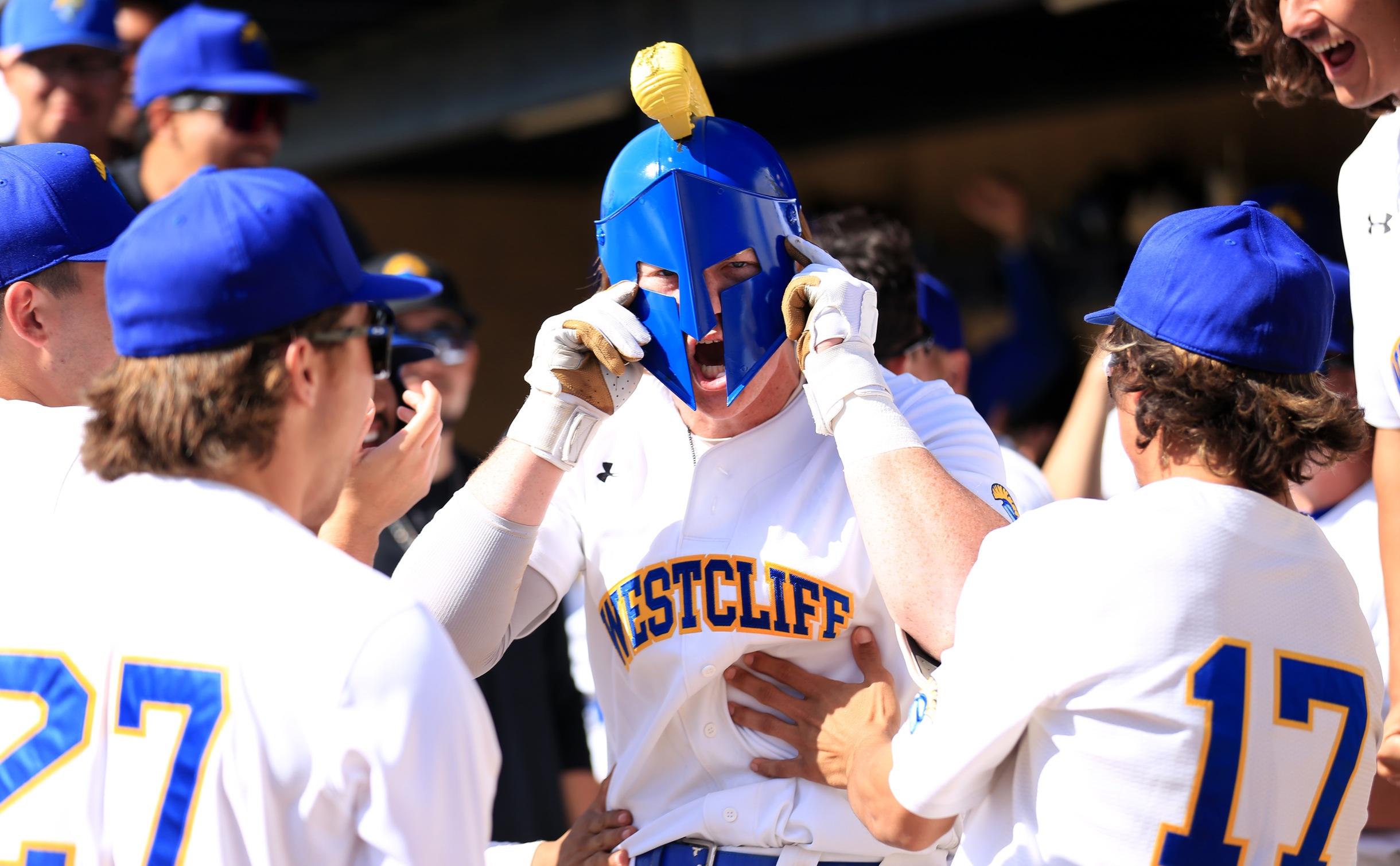 Nolan Wasson dawns the Warrior Head after crushing a homerun blast in the fourth. Photo by Brandon Petersen.